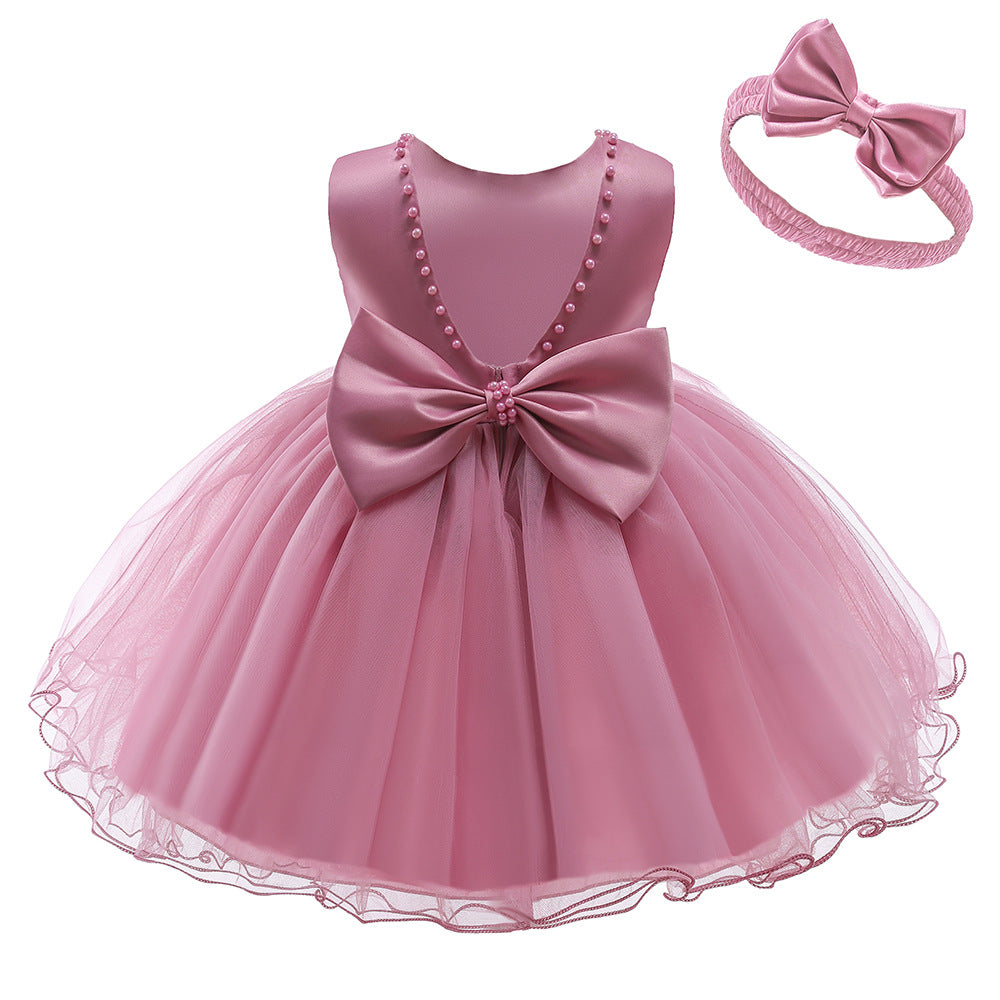 Vestido Rosa Vieja, perlitas, moño
