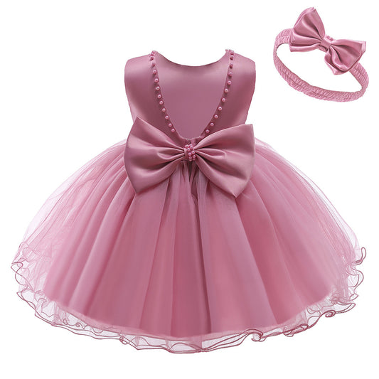 Vestido Rosa Vieja, perlitas, moño